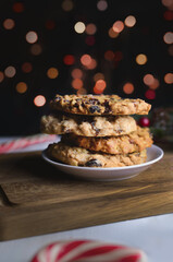 Christmas healthy oatmeal cookies with dried cranberries on wooden board. Gluten free bakery.