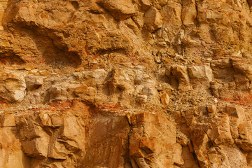 Stony slope of a sheer cliff. Textured background.