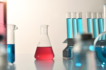 Glassware on laboratory bench front view flask detail