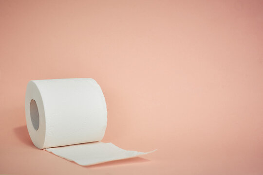 toilet paper on a pink background, essential goods, personal hygiene item
