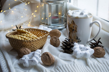 new year Christmas coffee with marshmallows with Christmas lights walnuts Christmas toys and cookies
