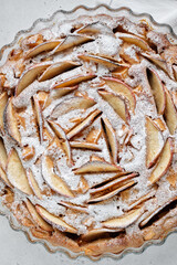 Charlotte apple pie with powdered sugar in the baking cup