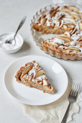 Charlotte apple pie with powdered sugar in the baking cup