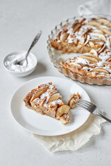 Charlotte apple pie with powdered sugar in the baking cup