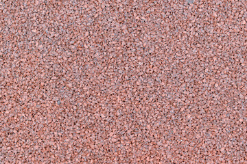 Surface of red elements for the backdrop. Concept of densely packed small stones.