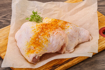 Raw chicken thigh with spices