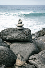 stack of stones on sea coast - Cairn