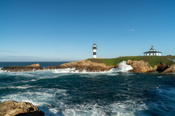Naklejka na ściany i meble view of the lighthouse on Isla Pancha in Galicia