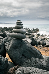stack of stones on sea coast - Cairn