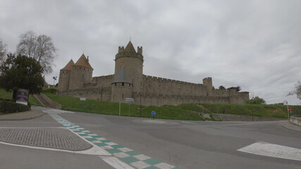 Fototapeta na wymiar Carcassonne / France - March 15, 2020: The Cité de Carcassonne is a medieval citadel in the department of Aude, Occitanie region. It is located on a hill on the right bank of the River Aude.