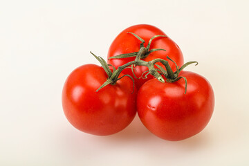 Red bright ripe tomato branch