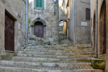 A narrow street among the old houses of Patrica, a medieval village in the Lazio region, Italy.

