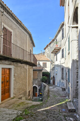 A narrow street among the old houses of Patrica, a medieval village in the Lazio region, Italy.

