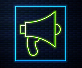 Glowing neon line Megaphone icon isolated on brick wall background. Speaker sign. Vector.