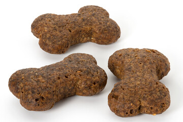 Three piece dry dog food on white background. Full depth of field. With clipping path