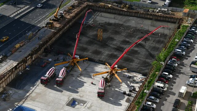 Time lapse of pouring concrete for foundation at construction site 