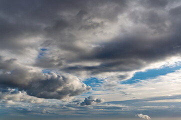 Obraz premium Fantastic dark blue thunderclouds at sunrise, natural composition
