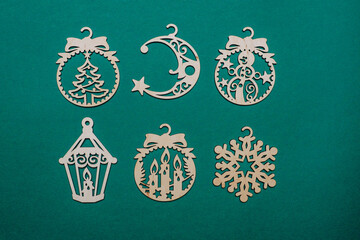 wooden christmas decoration on green background