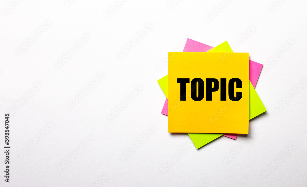 Poster on a light background - bright multicolored stickers with the text topic. copy space