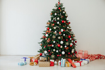 Christmas tree with gifts in the interer lights garland decor new year