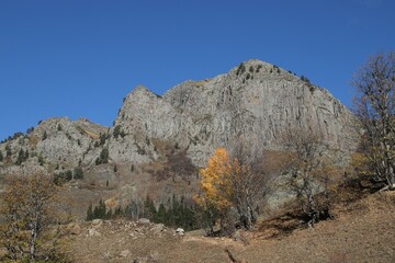 Snowy mountains covered in clouds beautified by the sky