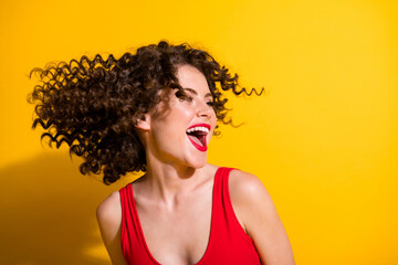 Close-up portrait of her she nice-looking attractive carefree glamorous cheerful cheery wavy-haired girl throwing hair having fun laughing isolated bright vivid shine vibrant yellow color background