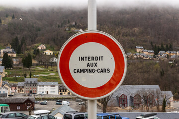 Cauterets / France - March 12, 2020: Signpost with caution notice of forbidden camping cars...
