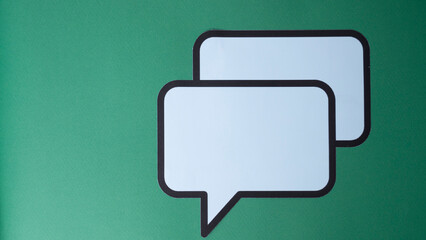 paper speech bubble on green background