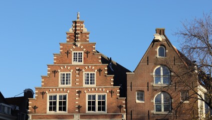 Fototapeta na wymiar Amsterdam Canal House Facades with Stepped and Spout Gables