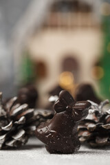 Christmas chocolates. Chocolate figurines-Santa Claus, hare, horse, dragon, bell