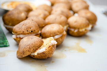 Several gray potatoes are on the table and ready to be fried.