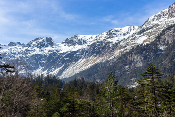 Fototapeta na wymiar The Nets Peak and Soum de la Heougade, viewed from the ski resort Pont d'Espagne in the French Pyrenees, in the department of the Hautes-Pyrénées, near the town of Cauterets, France.