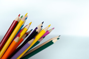 Different colored pencils photo for text. Copy Space. Back to school. White background.