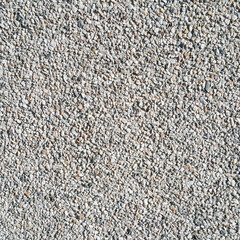 surface structure created by dusting, sifted sand with small stones, gravel walls, building facades, and fine texture