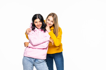 Pretty two women wear casual hoodies and jeans isolated white background