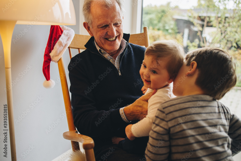 Wall mural Senior man with his two grandsons