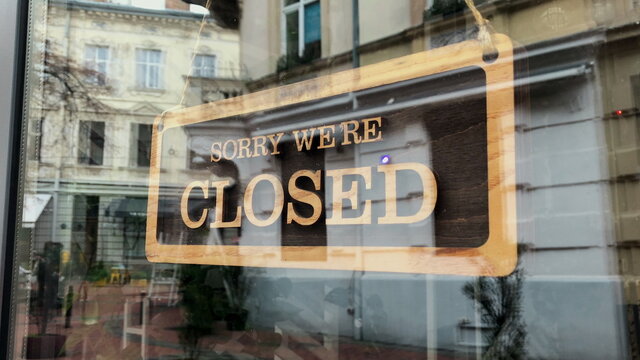 Temporarily Closed Sign For Covid-19 In Small Business Activity. Close Up On Closed Placard In The Window Of A Shop For Coronavirus.