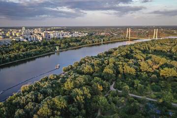 Naklejka premium Drone aerial view of River Vistula in Warsaw, capital of Poland - view from bank in Mokotow area
