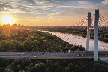 Sunset in Warsaw, capital of Poland - view with Siekierkowski Bridge over River Vistula