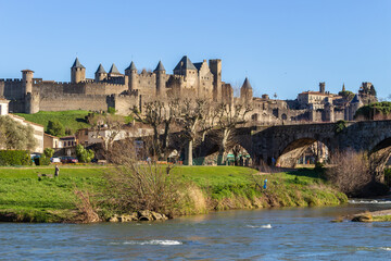 The River Aude and Old Bridge (Pont Vieux, 14th Cent) leading to Medieval town of Carcassonne...