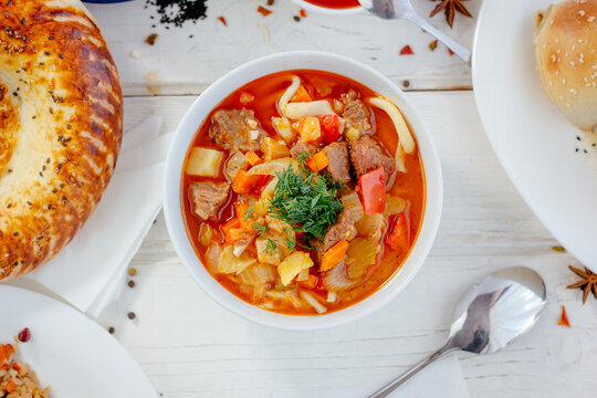 Top view of lagman or laghman uygur dish on white table.