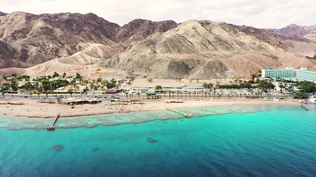 Aerial view of Eilat's Coral Beach Nature Reserve and Conservation area coastline. Pushing forward over the coast to the mountains.

