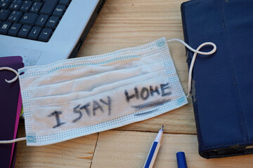 I stay home written on a mask at the office