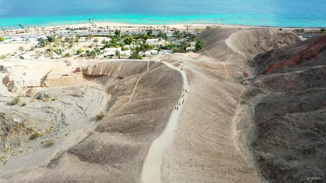 Aerial view on the end of the "Israel National Trail" at Eilat's Coral Beach Nature Reserve. Passing from the trail to the beach and to the horizon of the Red sea and the Jordan mountains.