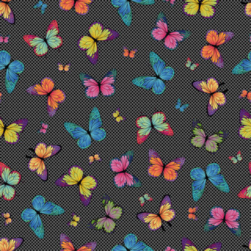 seamless vector pattern with multicolored butterflies on a background with small dots, on a dark background