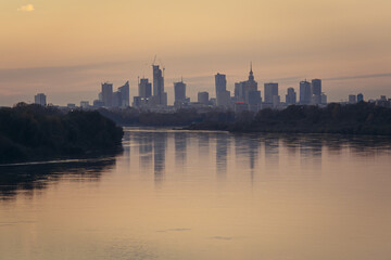 Fototapeta premium Vistula River and center district of Warsaw, capital of Poland - sunset view from Siekierkowski Bridge