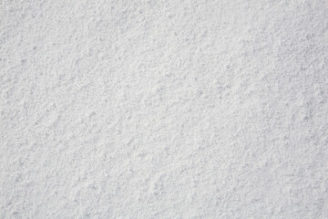 Snow texture. Shot on the slopes of the mountains.