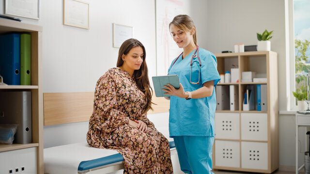 Doctor Consultation Office: Female Patient Listens to Experienced Head Nurse who Uses Digital Tablet Computer to Show, Explain Her Analysis Results, Give Advice, Prescribe Medicine. Gynecology ward