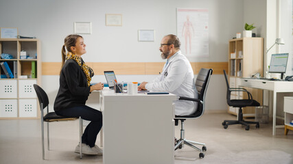 Patient Enters Doctor Consultation Office: Latin Woman Describes Her Complaints, Symptoms to Physician. Medical Health Care Professional Diagnoses Disease, Prescribes Medicine. Hispanic People