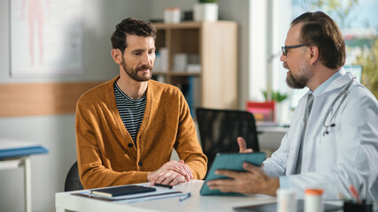 In a Doctor's Consultation Office: Professional Physician Talks to the Patient, Uses Digital Tablet Computer to Explain Test Results, Symptoms, Treatment Plan, and Prescribes Medicine 